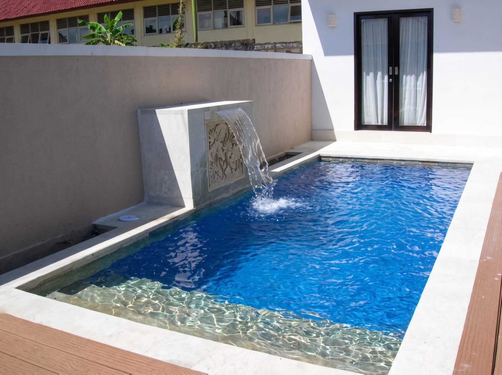 Custom water feature and spillway built by Tropical Pool in Bali