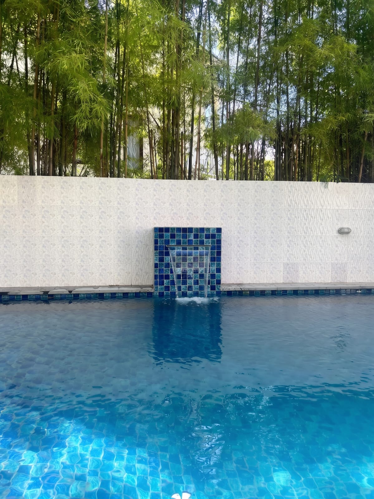 Spa spillway and water feature detail at a Bali pool