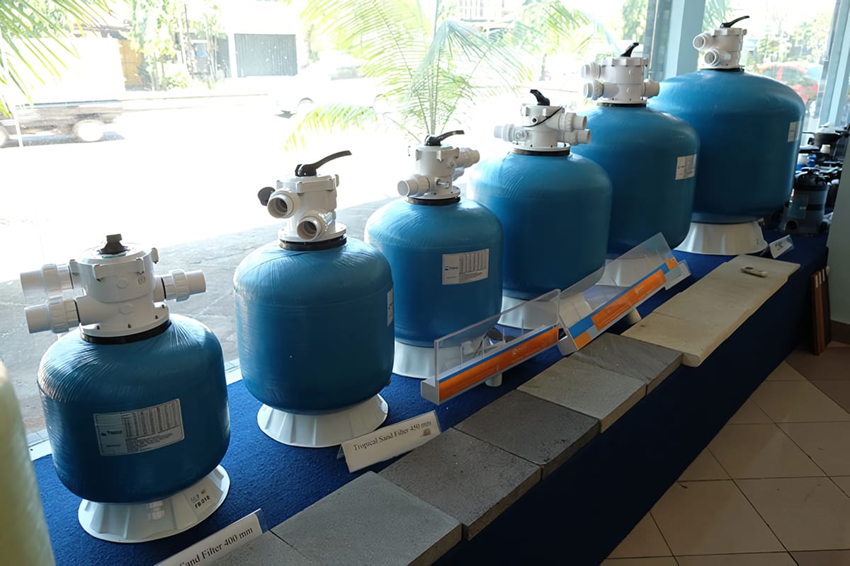 Sand filter and manifold in a pool plant room in Bali